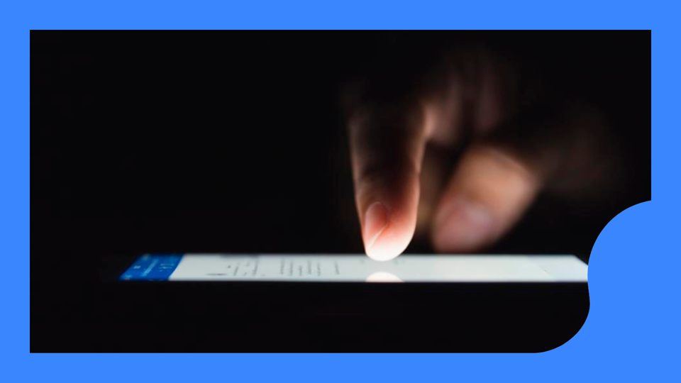 Finger touching phone screen.